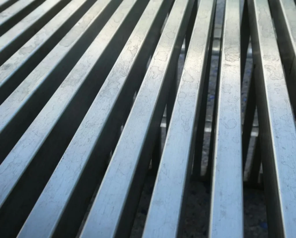 Close-up of galvanized steel bars showing the coated surface